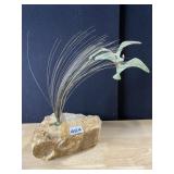 METAL BIRDS ON WIRE IN STONE