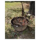 CAST IRON KETTLE IN YARD WITH HANDLES WAS USED AS