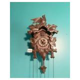 CUCKOO CLOCK WITH FIGURAL BIRD AND LEAF MOTIF,