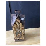 BIRD HOUSE FILLED WITH WINE CORKS