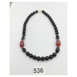 BLACK GLASS BEADED NECKLACE CINNABAR ENAMEL TUBE