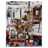 SECTION OF GARAGE WALL INCLUDING SCYTHE,