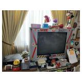 ITEMS ON TOP OF TV STAND IN LIVING ROOM INCLUDING