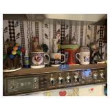 CONTENTS ON STOVE SHELF, MUGS, FIGURES, SALT &