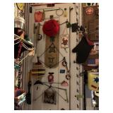 BUNGEES AND TRINKETS ON PANTRY DOOR
