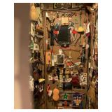 ITEMS HANGING ON ROOT CELLAR DOOR AND SURROUNDING