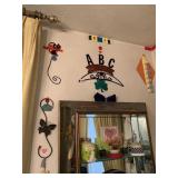 ITEMS ON WALL ABOVE MIRROR IN DINING ROOM