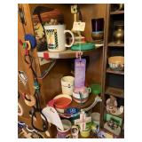 TRINKETS AND MUGS ON CORNER SHELF IN KITCHEN