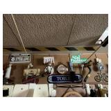 ITEMS HANGING ON AND ABOVE BASEMENT BATHROOM