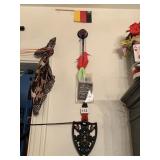 ITEMS HANGING NEXT TO KITCHEN DOOR FRAME ON WALL