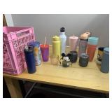 PLASTIC CRATE FILLED WITH CUPS AND DRINKING