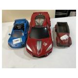 2 PLASTIC CARS, 1 RESIN CAR
