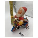 WIND UP SANTA ON A BICYCLE MADE IN KOREA HOLE ON