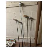 THREE GOLF CLUBS MOUNTED ON WHITE PAINTED WALL
