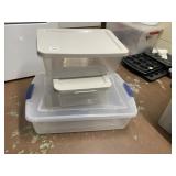 THREE CLEAR PLASTIC STORAGE CONTAINERS WITH WHITE