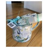 TURQUOISE BLUE ROUND BASKET CONTAINING BATH GIFT