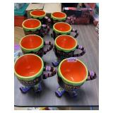 8 MATCHING 'WITCH AND FAMOUS' FOOTED COFFEE MUGS