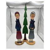 PAIR OF FOLK ART CHRISTMAS CAROLER FIGURES.