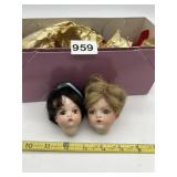 TWO ANTIQUE BISQUE DOLL HEADS.