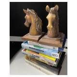 COMPOSITION BOOKENDS OF A HORSE HEAD ONE HEAD HAS