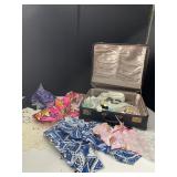 VINTAGE BLUE SUITCASE AND FABRIC SCRAPS, CROCHET