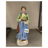 HAND-PAINTED PORCELAIN FIGURINE - WOMAN IN GREEN