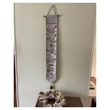 DECORATIVE TEXTILE WALL HANGING W/ FLORAL WREATH.