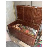 WICKER TRUNK W/ ARTIFICIAL FLOWERS & BOTANICALS.