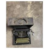 CORONA PORTABLE TYPEWRITER - BLACK W/ CARRY CASE,