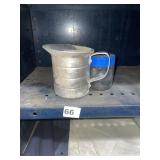 VINTAGE ALUMINUM MEASURING PITCHER & GLASS JAR.