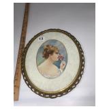 OVAL GILT METAL FRAMED ART.