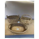 WOVEN WICKER BASKETS.