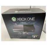 XBOX 360 CONSOLE W/ XBOX ONE BOX.