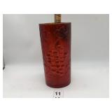 RED EMBOSSED GRAPE MOTIF VASE.