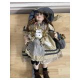 PORCELAIN DOLL W/ LIMITED EDITION NUMBER.