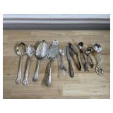 ASSORTED SILVER-TONE SERVING UTENSILS.