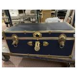BLUE STORAGE TRUNK W/ BRASS-TONE HARDWARE.
