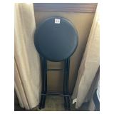 FOLDING STOOL, BLACK ROUND SEAT, METAL FRAME.