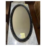 OVAL WALL MIRROR, ORNATE BLACK FRAME.