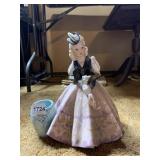 PORCELAIN WOMAN HOLDING SQUIRREL VASE