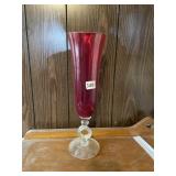 RED GLASS TWISTED STEM VASE.