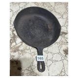 CAST IRON SKILLET, ROUND FORM, LOOPED HANDLE.