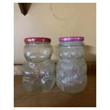 PAIR GLASS CHARACTER JARS W/ METAL LIDS.