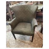 UPHOLSTERED WINGBACK ARMCHAIR W/ NAILHEAD TRIM.