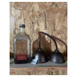 SUNBRUG STORES CRUDE OIL BOTTLE W/ TWO OIL CANS.