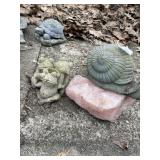 CONCRETE FROGS, METAL SNAIL, ROSE QUARTZ CRYSTAL.