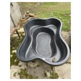 PLASTIC PREFORMED POND LINER.