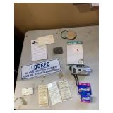 BATHROOM SIGN, 35MM CAMERA, FILM, MAGNIFIER