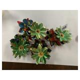 MULTICOLORED METALLIC FOIL FLOWER DECORATIONS.