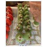 GREEN BEEHIVE WAX CANDLES W/ BEE ADORNMENTS.